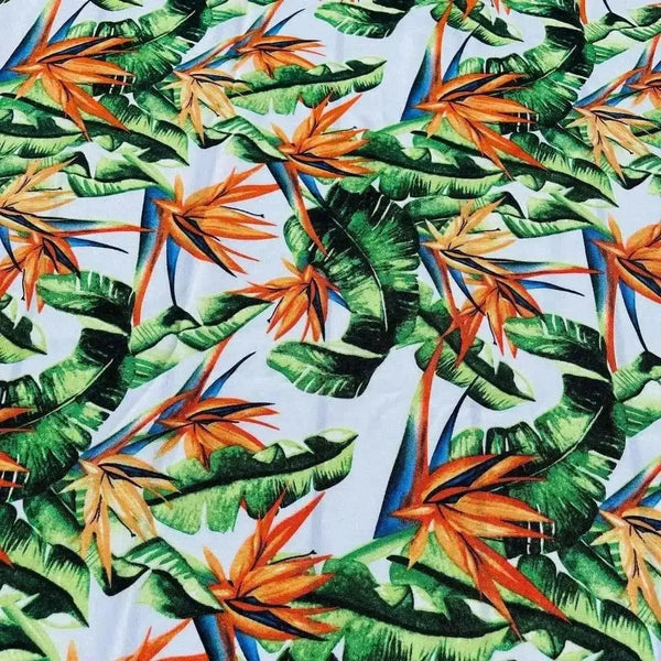 White tablecloth with watercolor strelitzia design on elegant dining table
