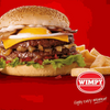 Wimpy Burger with Relish Sauce, cheese, and fries on a red background.