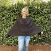 Black knitted cotton winter poncho with round neck
