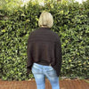 Black knitted winter poncho with round neck cotton road design