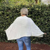 Cream knitted Winter Poncho with round neck by Cotton Road