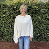 Cream knitted cotton winter poncho with round neck