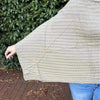 Light brown knitted winter poncho with round neck by Cotton Road