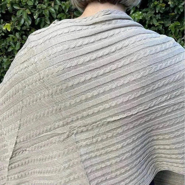 Light brown knitted winter poncho with round neck from Cotton Road