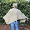 Light brown knitted winter poncho with round neck by Cotton Road