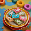 Colorful Bakers Zoo Biscuits with iced animal shapes on vibrant backgrounds in 150g pack
