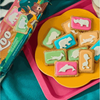 Colorful Bakers Zoo Biscuits with iced animal shapes on vibrant backgrounds, 150g pack