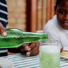 Bright green South African cream soda bottles showcasing the country's iconic sweet vanilla soft drink