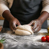 Ingredients for pizza dough nz being mixed in a bowl with wooden spoon