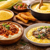 Varieties of corn meal NZ in bowls and spoons showing yellow and white maize products