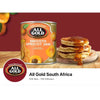 All Gold Smooth Apricot Jam 900g tin next to pancakes with apricot jam drizzle on wooden surface