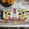 Bakers Choice Assorted - 200g box of assorted cookies on a wooden table with flowers.