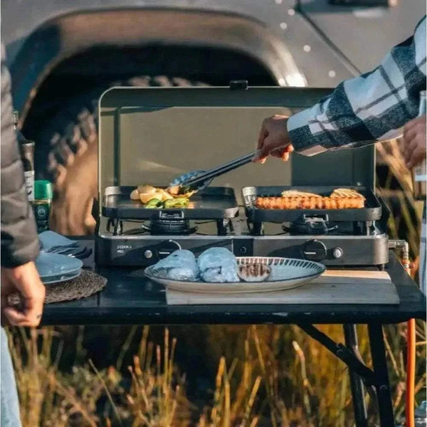 CADAC 2 Cook 3 Pro portable dual-burner gas barbecue with flat and ribbed GreenGrill plates for versatile outdoor cooking