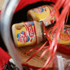 Melrose Bacon Cheese Spread 400g jars in a basket.