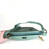 Cotton Road Sling Bag in green PU leather with weave effect and adjustable strap