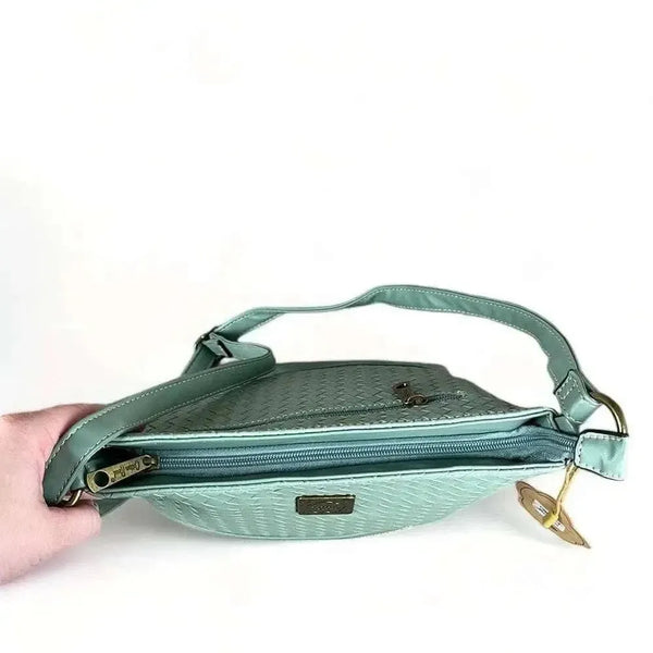 Cotton Road Sling Bag in green PU leather with weave effect and adjustable strap