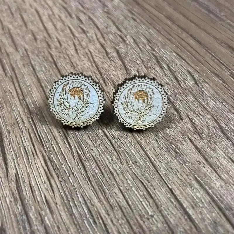 Earrings light blue circle with laser engraved protea 15mm pair