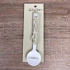 Enamel sugar spoon with wooden handle and laser engraved birds on a wire design