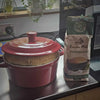Eureka Mills Potbrood Easy Home Mix - 1kg next to freshly baked potbrood in red pot.