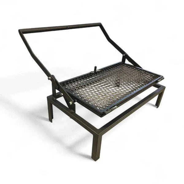 Flipbraai - Large mild steel portable grill with foldable legs and unique flip mechanism for even cooking outdoors.