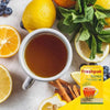 Freshpak Rooibos Tea 40's box with a cup of rooibos tea surrounded by lemon slices, mint leaves, and cinnamon sticks