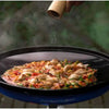 CADAC Skottel Braai cooking variety of foods outdoors, showcasing versatile and robust gas BBQ.