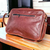 Woesmooi genuine leather dark laptop bag with adjustable shoulder strap for laptops up to 15.6 inches