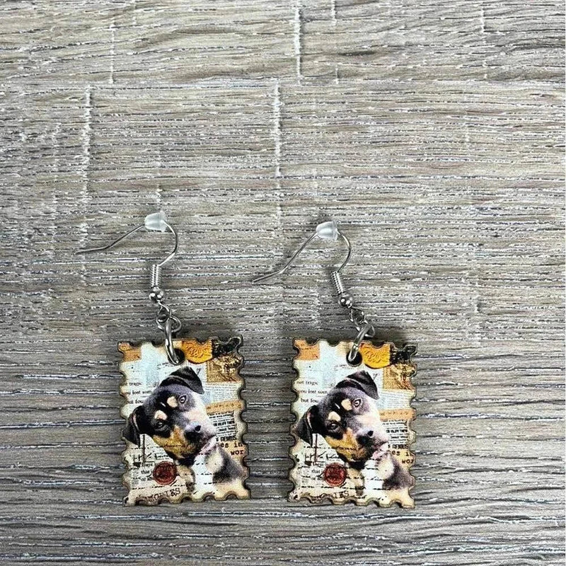 Hanging earrings featuring postage stamp design with a dog, nickel free, made in South Africa, sold in pairs