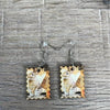 Hanging earrings featuring postage stamp design with rabbit, nickel-free, sold in pairs, made in South Africa