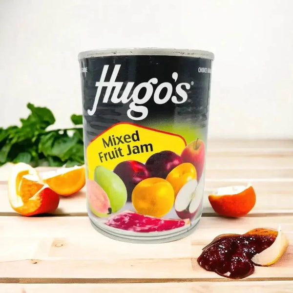 Hugo's Mixed Fruit Jam 450g jar with assorted fruits background