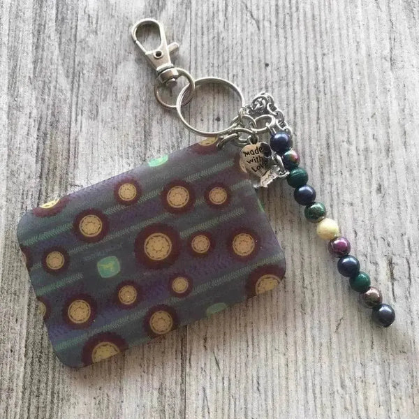 Keyring featuring tractor tyres design, size 65mm x 45mm