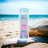 Oh So Heavenly Mermaid At Heart Body Lotion on a beach with ocean view.