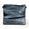 Black PU leather sling bag with adjustable strap and multiple zip compartments