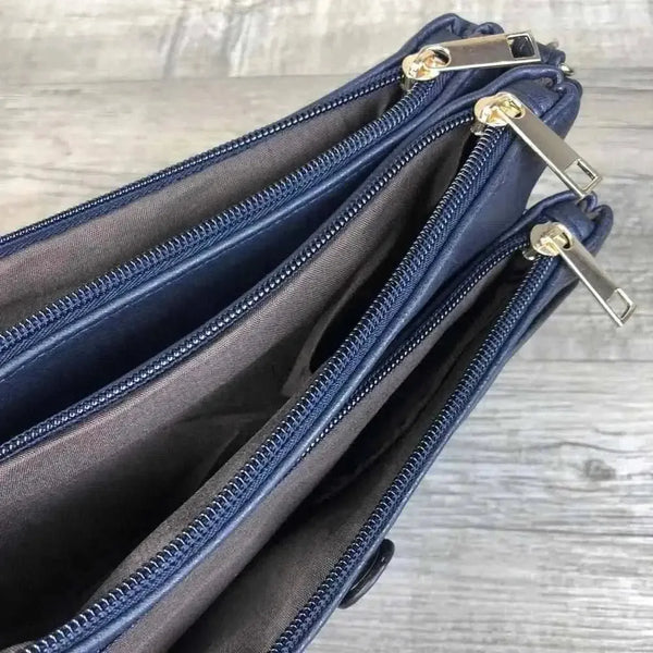 Navy PU leather Sling Bag with adjustable strap and multiple zip compartments