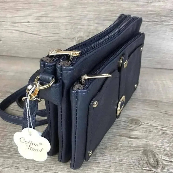 Navy PU leather sling bag with adjustable strap and multiple zip compartments