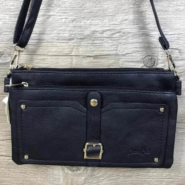Navy PU leather sling bag with adjustable strap and multiple zip compartments
