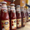 All Gold Tomato Sauce 700ml bottles on shelf.