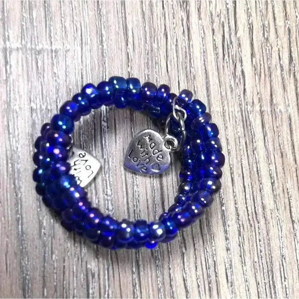 Serviette rings with large purple beads in a 6 pack made with love