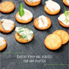 Bakers Pyotts Kips Biltong Flavoured Crackers - 200g displayed on a platter with creamy toppings.