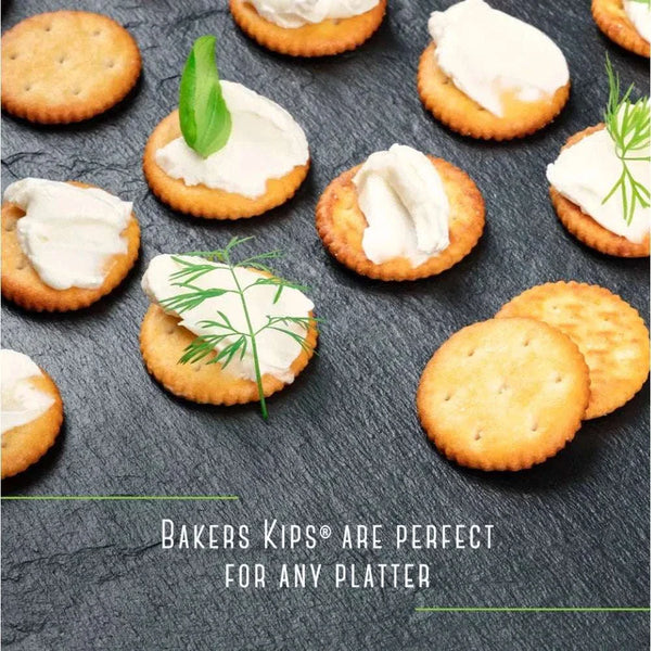 Bakers Pyotts Kips Biltong Flavoured Crackers - 200g displayed on a platter with creamy toppings.