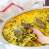 Royco Cook-in-Sauce Bobotie 50g with meat and vegetable dish in white casserole.