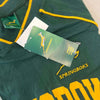Green Springbok Official Licensed Supporter T-Shirt with yellow trim and logos, featuring embroidered Springbok logo and tags.