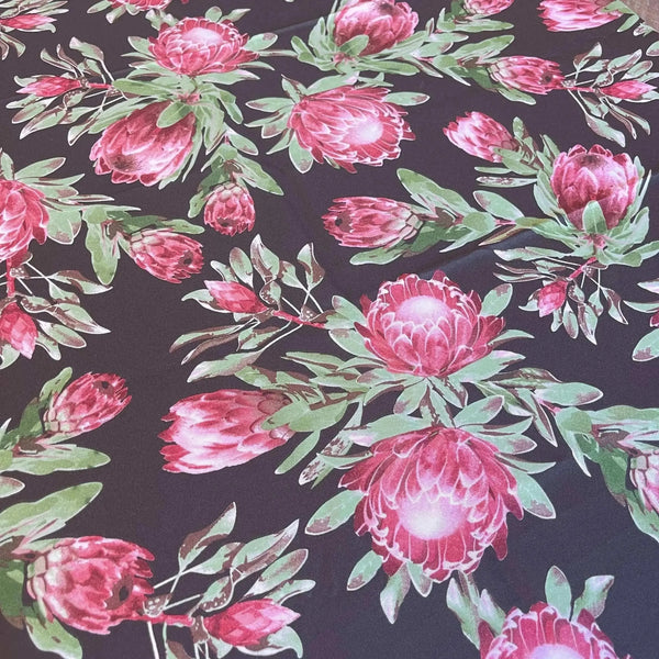 Black tablecloth with vibrant pink proteas, 275cm x 140cm, South African design