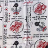 White tablecloth with Afrikaans sayings enhancing dining elegance and cultural charm