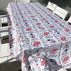 White tablecloth with Afrikaans sayings on elegant dining table setting