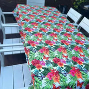 White tablecloth with tropical flower design on dining table