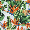 White tablecloth with watercolor strelitzia design on elegant dining table
